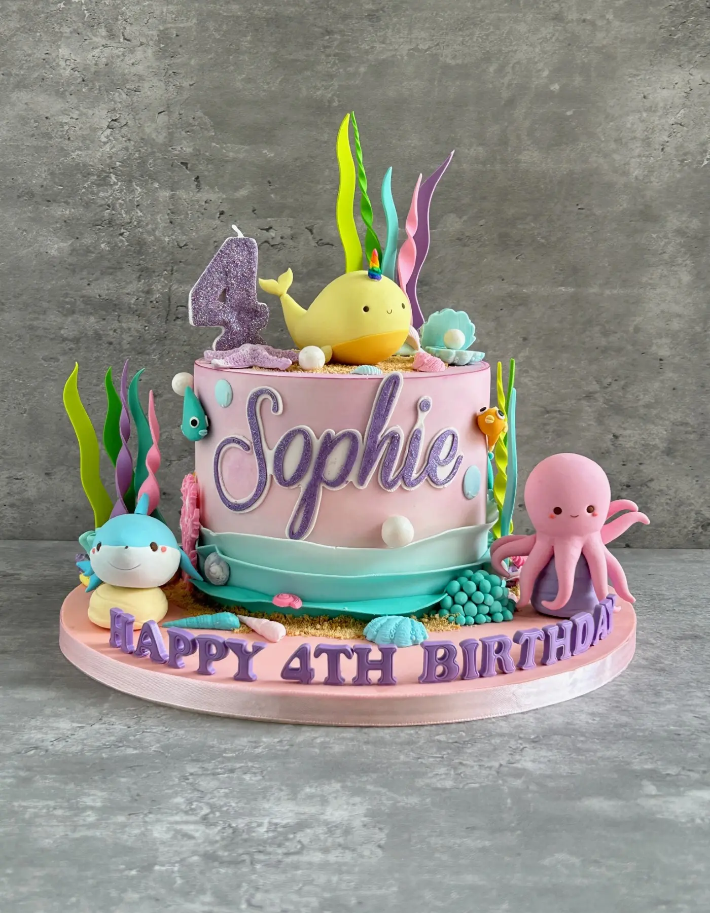 Under-the-sea 4th birthday cake with fondant whale, octopus and seaweed
